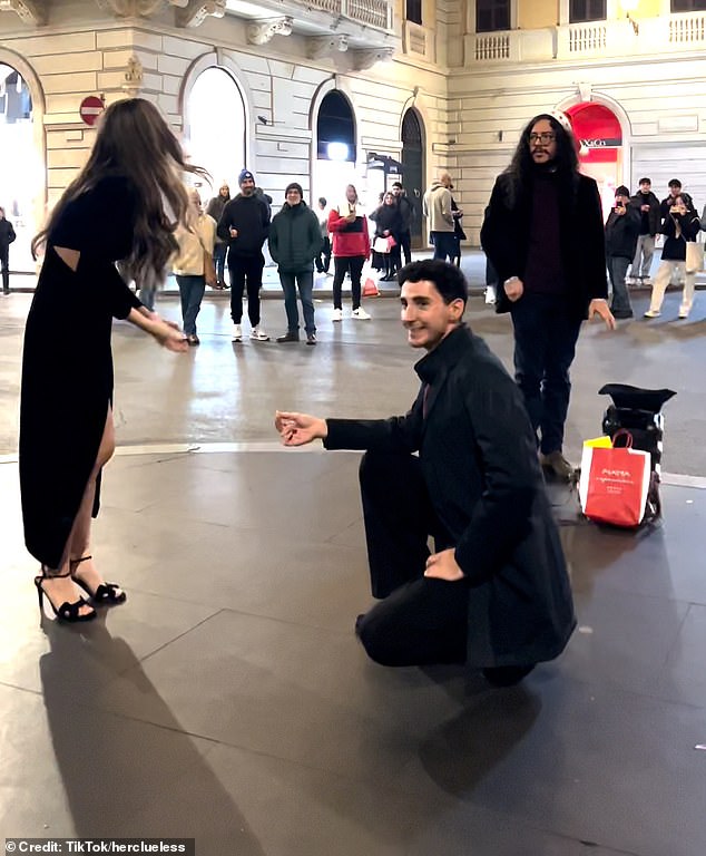 But his partner's body language is immediately awkward as she repeatedly gestures and begs him to stop in front of the audience as the romantic music continues.