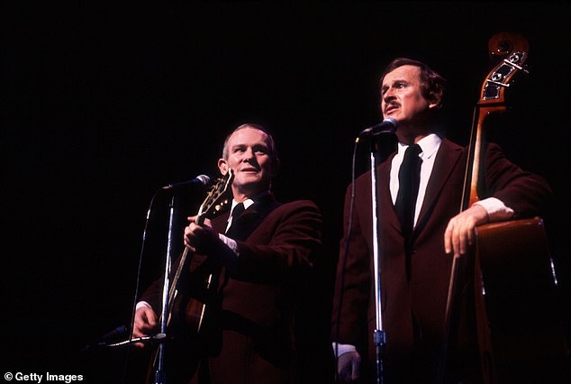 Tom and Dick Smothers perform in Chicago in February 1983