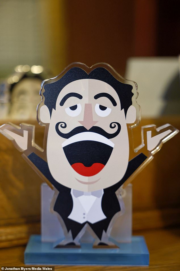 In addition to colorful walls and striking artwork, his opera singing alter ego Gio Compario's mustache is framed and hanging on the wall