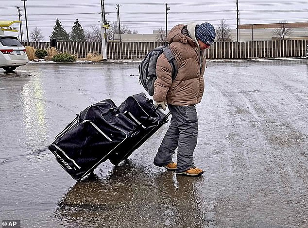 Ice-covered streets and sidewalks made walking and driving difficult