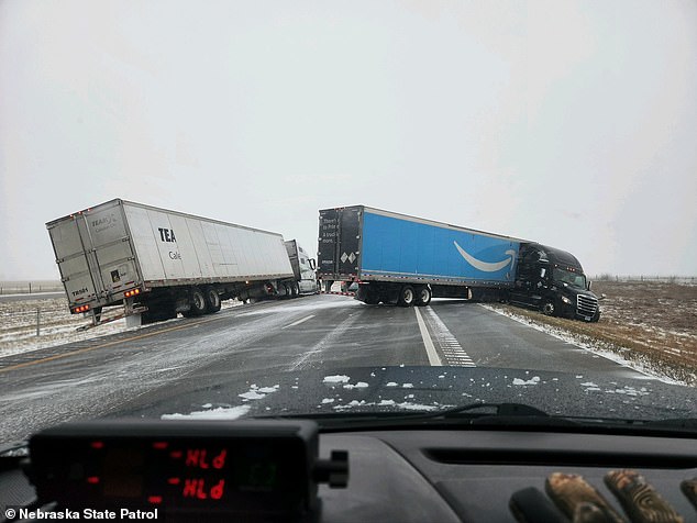 Snow on the Great Plains has forced crews to clear treacherous roads over the holiday weekend