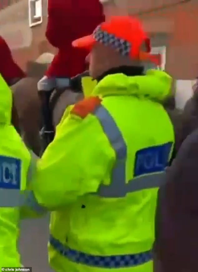 Witnesses also claim that another protester, whose disturbance was not caught on camera, threw a set of crutches at the following horses as they paraded down the road.  She then allegedly tried to throw herself onto the road but was stopped when Kent Police intervened