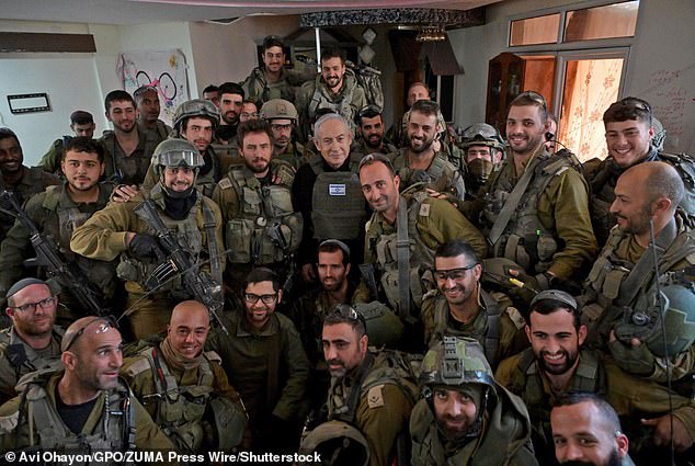 Mr. Netanyahu (pictured posing for a photo with Israeli troops) responded by saying that the Turkish president should be the last person to lecture Israel.