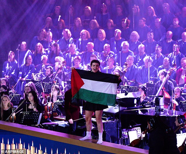 The demonstrators managed to unfurl the Palestinian flag next to the orchestra pit before being dragged off stage