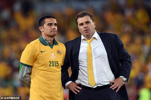 Postecoglou (photo with Tim Cahill) after winning the Asian Cup in Sydney in 2015