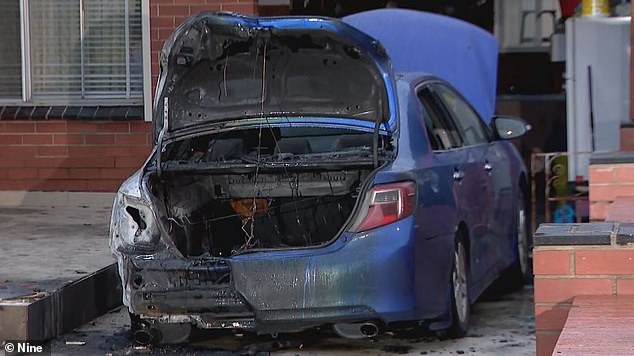 The blue car was doused with accelerant and set on fire by an unknown group of perpetrators