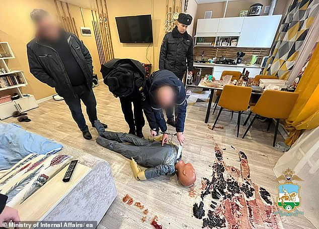 Ormandzhi reconstructs how he carried out the attack with a doll in front of police officers