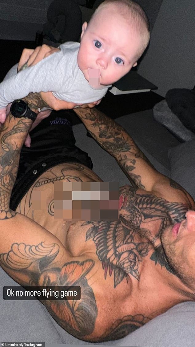 In the candid photo posted to Instagram on Thursday, the 31-year-old reality star is seen lying on his back, holding his newborn to his chest, while his abs are covered in fresh vomit