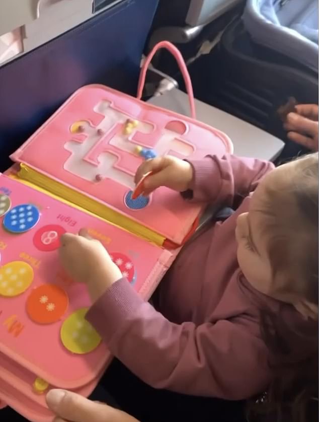 We recently took our little girl on her first trip to visit family in Colorado for Thanksgiving.  We purchased a busy board, especially for this task, which contains different motor skill activities
