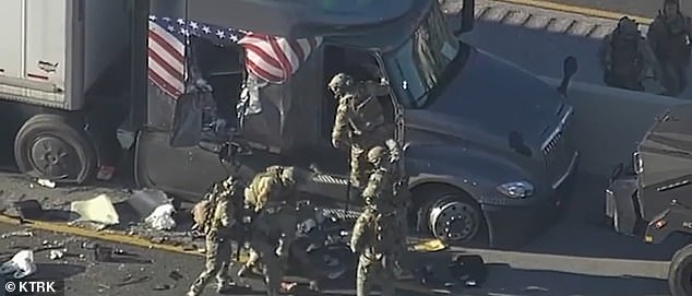 After the tractor-trailer was finally stopped, the excavator tore an initial hole in the cab allowing the SWAT team to throw an object into the vehicle.