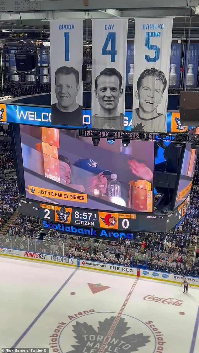 The crowd erupted in cheers after the announcer revealed the couple was in attendance at the Scotiabank Arena in Toronto, Ontario, Canada.