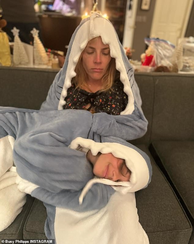 She also shared a photo of her and her youngest daughter, Cricket, 10, wearing shark onesies and cuddling together on the couch