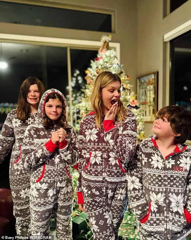 In her post, she shared a photo of her two daughters, wearing matching fleece pajamas with their cousins, as they stood in front of a sparkling evergreen tree.