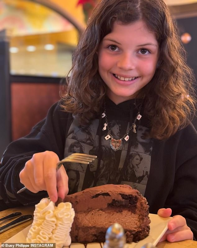 She posted a photo of Cricket beaming, wearing a Taylor Swift tour merch hoodie and getting ready to take her first bite of a chocolate cake.