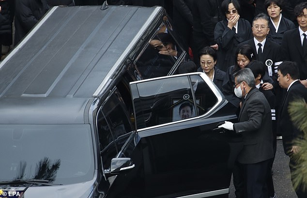 Lee's wife and two sons looked heartbroken as they attended the star's funeral today