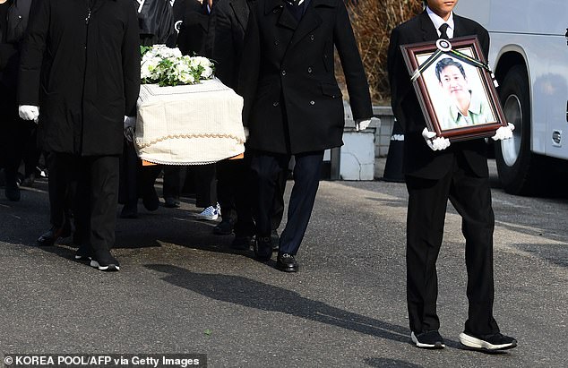 Mourners carry a portrait and the coffin containing the late South Korean actor Lee after his funeral ceremony at Seoul National University Hospital in Seoul