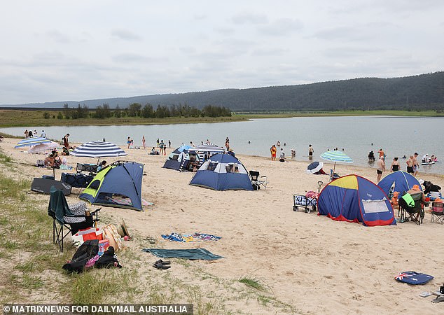 The 200-meter-long sandy beach on the man-made beach was lined with tents and umbrellas