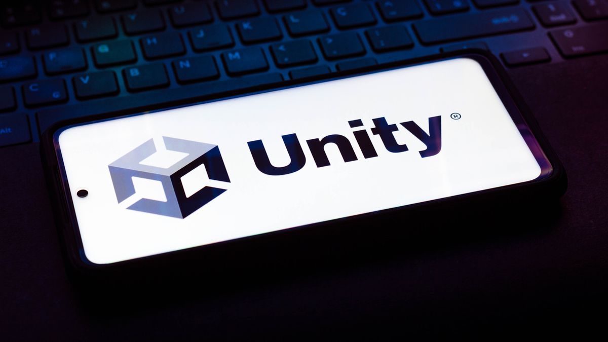 This photo illustration shows the Unity Technologies logo on a laptop keyboard