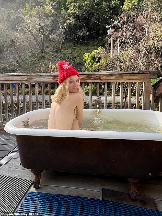 Mulvaney later documented a road trip with friends to a woods retreat, where she posed nude in an outdoor pool wearing only a red cap.