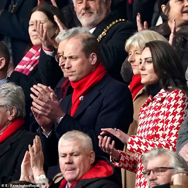 William and Kate, bundled up against the cold, applaud at a sporting event