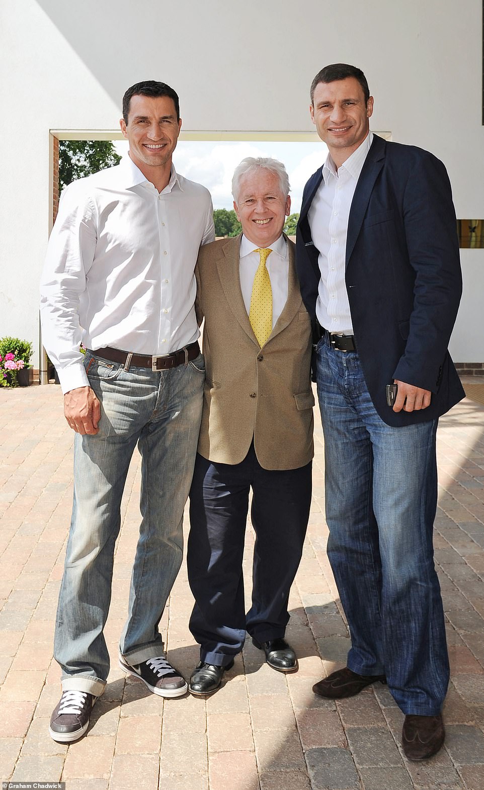 Legendary Ukrainian heavyweight boxing stars Wladimir and Vitali Klitschko pose next to Jeff during an interview in 2011