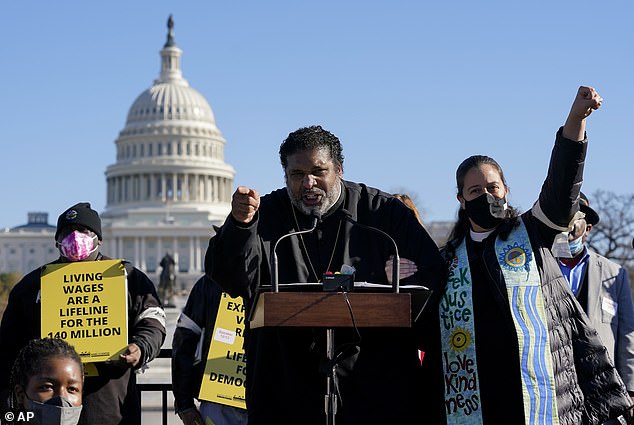 Barber pictured in Washington, DC, leading a rally in December 2021 asking Congress to pass voting rights protections while speaking about the 'Build Back Better Act'