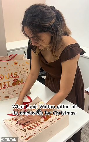 The clip showed her holding up a gift bag with the words Louis Vuitton on the front