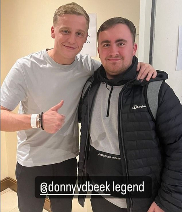 Littler also posed for a photo with Manchester United midfielder Donny van de Beek (left)