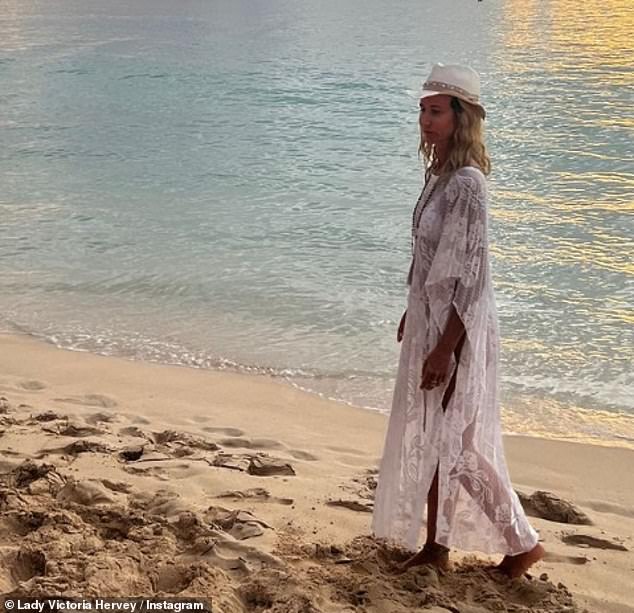 In another snap, the star cut an elegant figure in a stunning full-length white lace cover-up that was decorated with intricately embroidered flowers