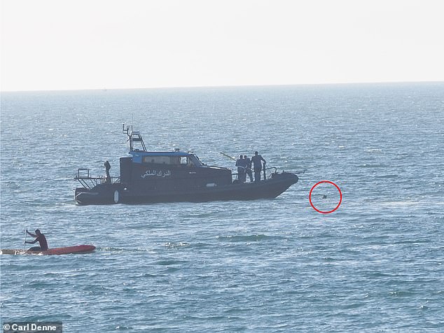 The attacker can be seen among jet skis and boats, with his head floating above the water