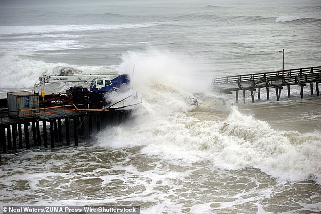 High tides and rain caused large waves to crash onto the shoreline, causing flooding in Capitola Village Thursday morning