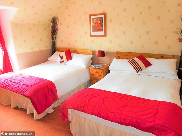 A bedroom in the hotel is pictured before it was completely destroyed by the floods while the owners were away