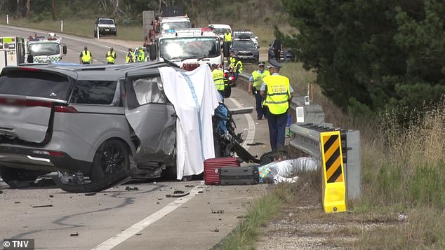 NSW Police were seen at the scene of the five-car crash that left two fathers dead on Friday