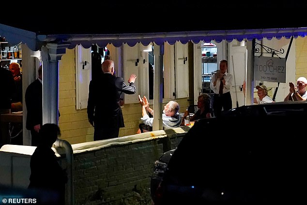 President Biden waves to some customers as he leaves Too.Chez restaurant