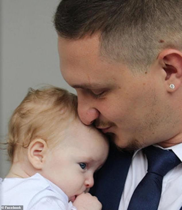 Kevin Malligan is pictured kissing his daughter Ivy on the forehead.  He is in a coma in Bali