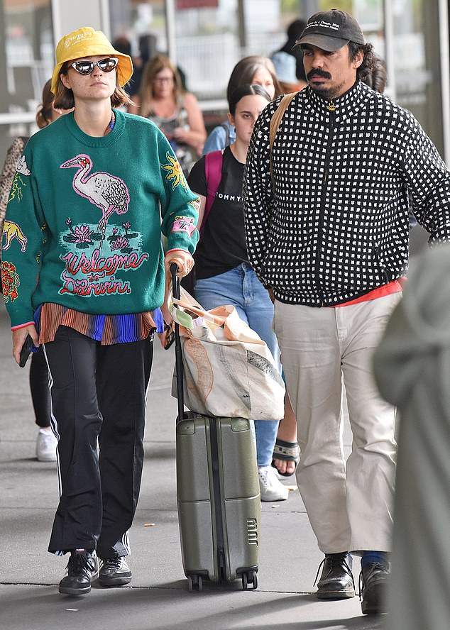 ABC News Breakfast sports presenter Tony looked trendy in a bold, black and white puffer jacket layered under an orange shirt and beige trousers