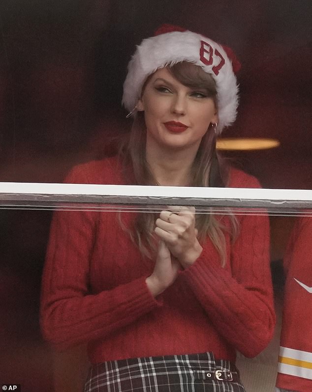 She appeared at Arrowhead Stadium (seen above) on Christmas Day when the Chiefs lost to the Las Vegas Raiders.  The singer-songwriter was spotted embracing the holidays by wearing a Santa hat with the number '87' printed on the front