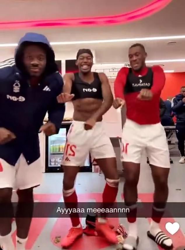 Elanga was joined by teammates Ola Aina (left) and Callum Hudson-Odoi (right) to celebrate the win