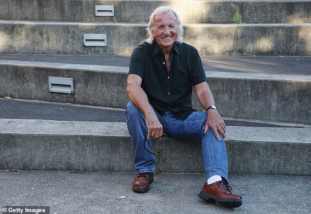 John Pilger poses outside the premiere of his film Utopia in Sydney, Australia in January 2014