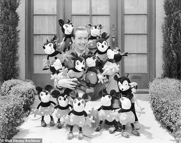 Walt Disney with Mickey Mouse plushies