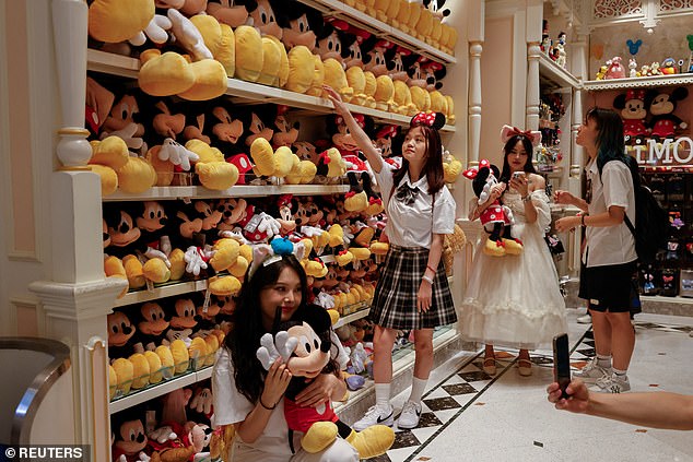 Fans shop at the Mickey Mouse store at Hong Kong Disneyland