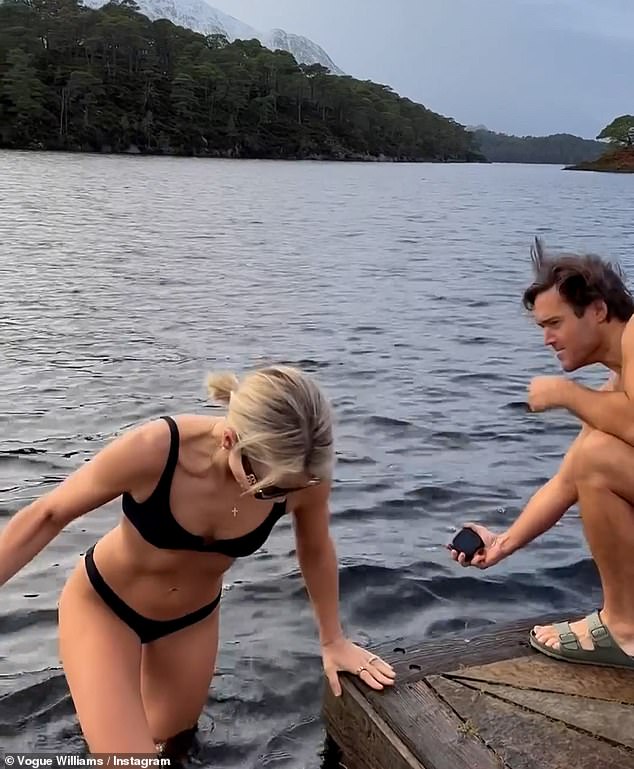 Vogue stripped down to a black bikini and showed off her toned figure as she shivered at the water's edge as husband Spencer cheered her on