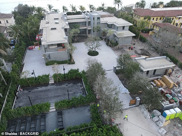 Also on site is a tree-lined driveway leading to a multi-car garage