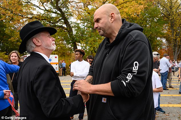 Fetterman (right) with Rabbi Jeffrey Myers of the Tree of Life Synagogue (left) during the commemoration ceremony marking the fifth anniversary of the attack on the Tree of Life Synagogue on October 27 in Pittsburgh