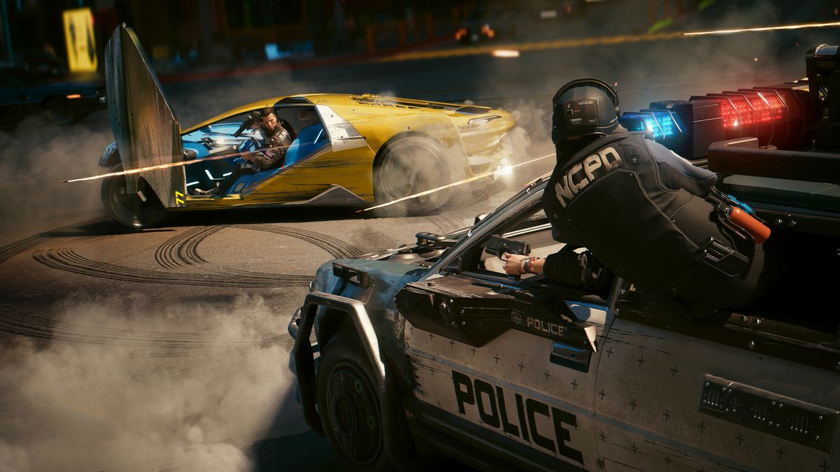 V, the player character in Cyberpunk 2077, drives away from a pursued police car while firing a weapon in Cyberpunk 2077.