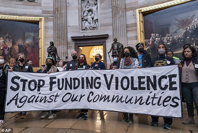 Anti-war activists take over the Rotunda at the US Capitol to demonstrate against hostilities in Gaza, Tuesday, December 19, 2023 in Washington