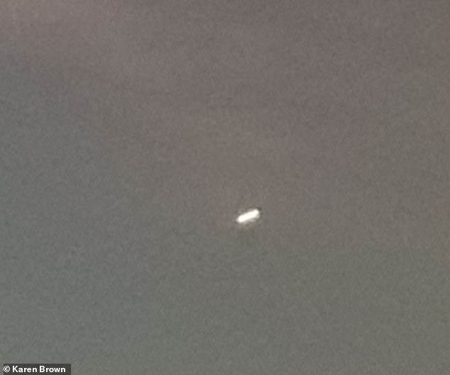 Karen Brown, from Stockport, was looking out her kitchen window when she spotted the unidentified flying object (UFO).