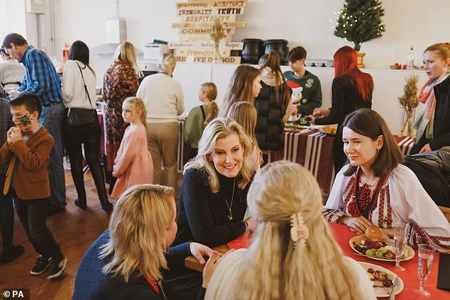 Sophie beamed as she chatted to a Ukrainian woman at the Christmas party in Surrey