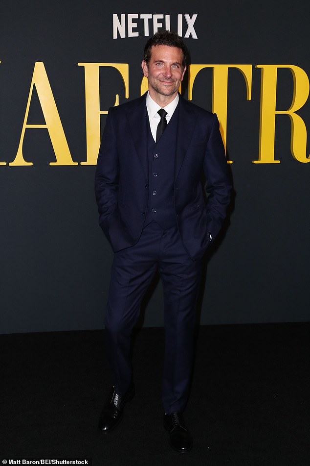 Bradley looked dapper in a navy blue three-piece suit, teamed with a white shirt and black tie