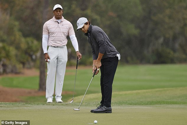 Tiger watches as Charlie hits the first green at the PNC Championship in Orlando